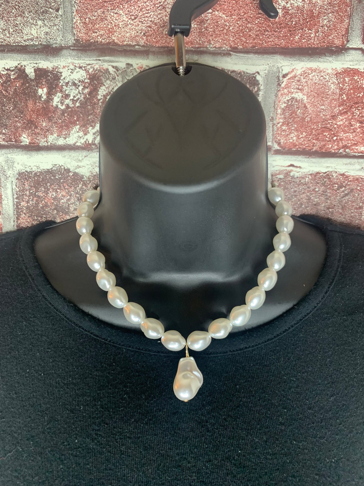 close up of necklace on mannequin