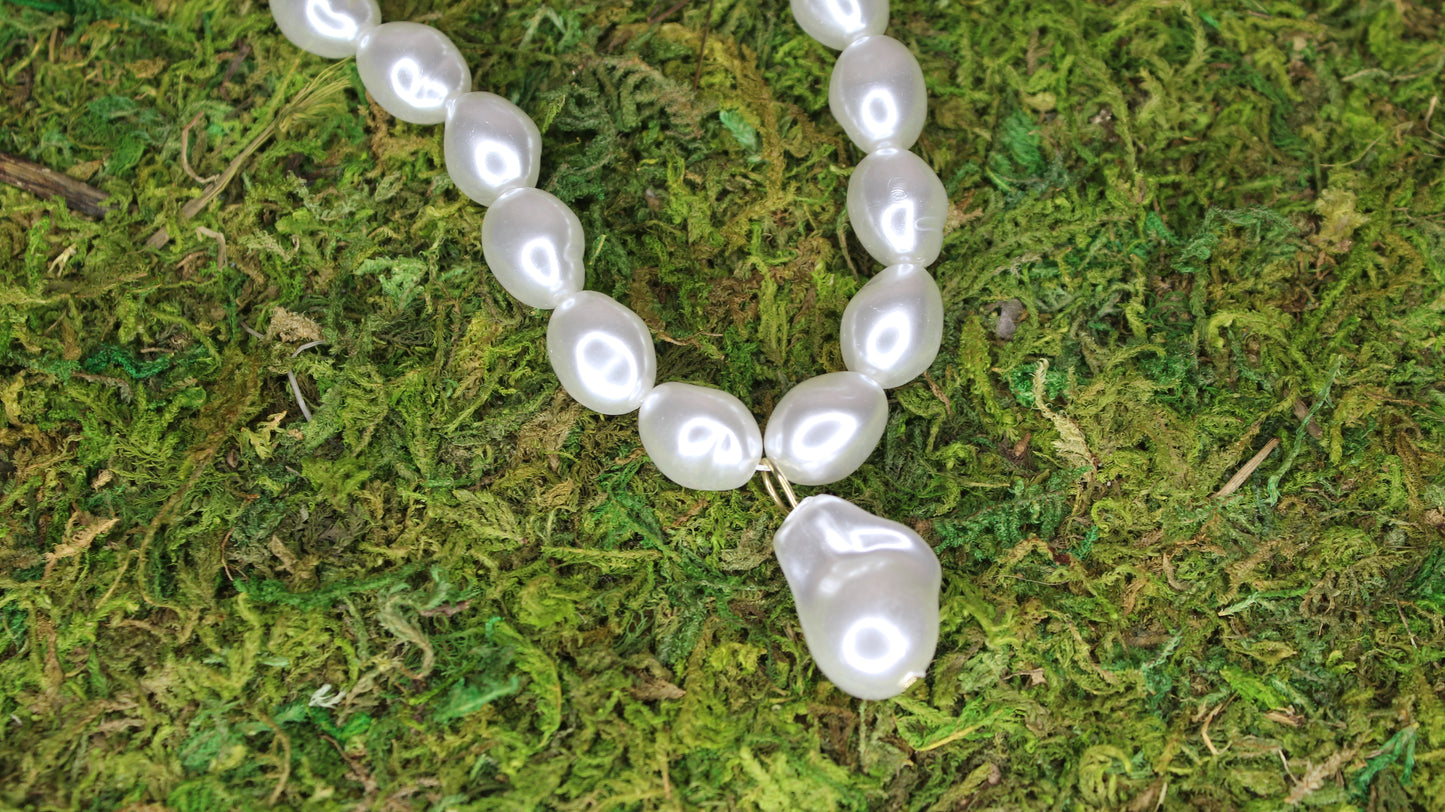 necklace on grass close up
